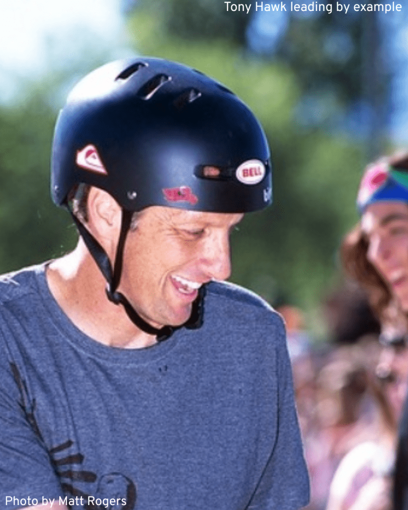 Tony Hawk wearing a helmet showing his leadership qualities and wisdom and respecting skateboarding laws