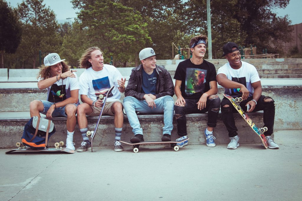 5 young guys looking to expand their knowledge and wisdom about skateboarding by reading about skating tips and instruction